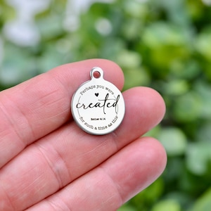 May include: Silver charm with the text "Perhaps you were created for such a time as this" and a small heart. The text "Esther 4:14" is also included.