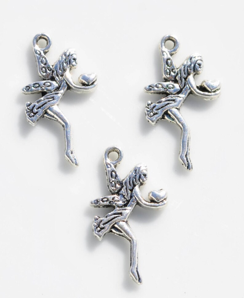 BULK 50 Fairy holding a Heart Silver Tone Charms SC6522