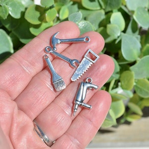 10 Mixed Set Tools  Drill, Saw, Pliers, Wrench, Keys, Ax, Paint Brush, and Hammer Silver Tone Tool Charms SC5418