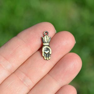 10   Heart in Hand Bronze Tone Charms BC1446