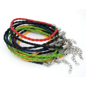 May include: Assortment of eight braided leather bracelets in various colors, including black, red, green, yellow, and blue. Each bracelet has a silver clasp and a silver chain extension.