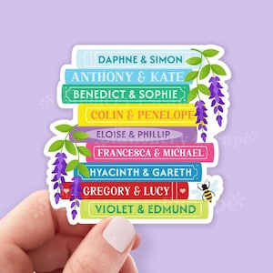 May include: A colorful sticker featuring a stack of books, each labeled with a couple's names. The books are in various colors, with floral accents and a small bee illustration. The names include Daphne & Simon, Anthony & Kate, and others.