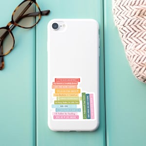 May include: A white iPhone case with a stack of colorful book spines featuring quotes about reading. The quotes include "The book was better", "Just one more chapter", "I like big books & I cannot lie", "So many books, so little time", "Books are my love language", and more.