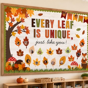 May include: A rectangular bulletin board display featuring a white wood-grain background, a brown tree, and colorful autumn leaves. The text reads "EVERY LEAF IS UNIQUE, just like you!" with small circular photos of children placed on individual leaves.