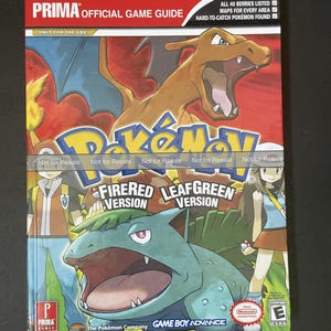 May include: A Prima Official Game Guide for the Game Boy Advance video games Pokémon FireRed and LeafGreen. The cover features Charizard and Venusaur, with text that reads "All 40 Berries Listed" and "Maps for Every Area."