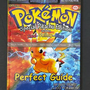 May include: A guide book for the Pokemon video game series, featuring Pikachu on the cover. The book is titled "Pokemon Special Pikachu Edition" and includes the words "Red-Yellow-Blue". The book cover is red, yellow, and blue, with a white background. The book is titled "Perfect Guide" and includes the text "Infinite Items! Lv.100 Pokemon! Plus More Incredible Secrets Inside!"