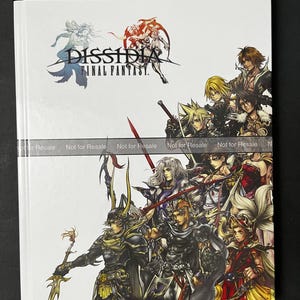 May include: A white guide book with a black and red cover featuring the title "Dissidia Final Fantasy" and a group of characters from the game. The book is a Bradygames Signature Series Guide and includes the text "Take Your Game Further."