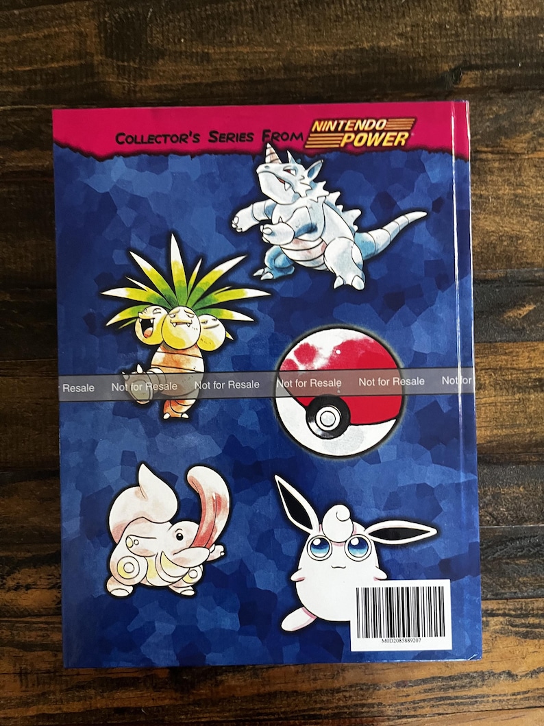 May include: A book cover with Pok&eacute;mon characters on a blue background. The cover has the text "COLLECTOR'S SERIES FROM NINTENDO POWER." The Pok&eacute;mon include Exeggutor, Wigglytuff, and a Pok&eacute; Ball. The cover has a barcode.