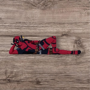 Deadpool sticker laying down