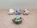 Miniature Ceramic Teapot Figurine: Hexagonal Dollhouse Decor product logo