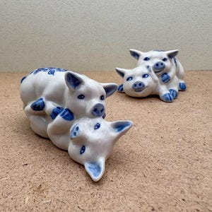 Ceramic Pig Figurines with Blue Floral Details – Front View & Side View Options – Playful Collectibles for Animal Lovers and Home Decor