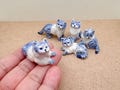 Handcrafted Blue & White Porcelain Cat Figurine: Collectible Ceramic Kitty product logo