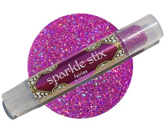 May include: A tube of "Sparkle Stix" glitter glue in a clear plastic tube with a purple label and gold accents. The glitter is a vibrant pink colour, and the background is a large circle of pink glitter.