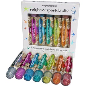 May include: A box set of seven holographic rainbow glitter sticks. Each stick is a different color, including silver, purple, blue, green, orange, and red. The box reads "rainbow sparkle stix" and "7 holographic rainbow glitter stix."