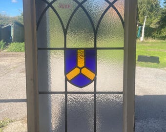 Antique Stained Glass Window with Blue and Yellow Shield Design