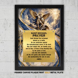 May include: A framed canvas wall art piece featuring a depiction of Saint Michael the Archangel with wings and a sword. Centered is a gold-coloured metal plate with black text of the Saint Michael Prayer, including the word AMEN at the bottom.