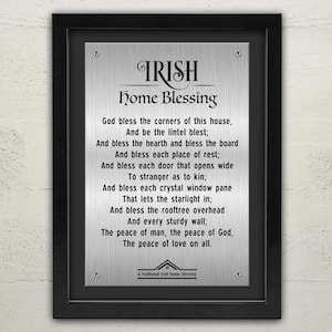 May include: A silver metal plaque with a black frame, featuring an Irish home blessing poem. The poem reads: "God bless the corners of this house, And be the lintel blest; And bless the hearth and bless the board And bless each place of rest; And bless each door that opens wide To stranger as to kin; And bless each crystal window pane That lets the starlight in; And bless the rooftree overhead And every sturdy wall; The peace of man, the peace of God, The peace of love on all."