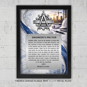May include: A framed wall art piece featuring a silver metal plate with the text Engineer's Prayer by Michael Lovato. The background displays blue architectural blueprints, a gear, a compass, a ruler, a white hard hat, and a construction site.
