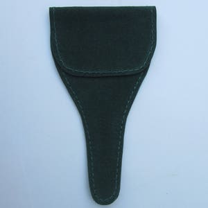 May include: A dark green felt pouch with a pointed bottom and a flap closure. The pouch is stitched with a light green thread.