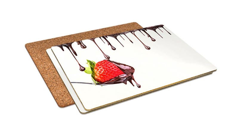 May include: A set of two rectangular coasters. One is a natural cork, the other is white with a graphic of a chocolate-covered strawberry. Dark chocolate drips from the top of the coaster.