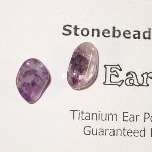 May include: A pair of amethyst ear studs with titanium posts and clutches. The ear studs are made in Trinity Bight, NL. Stonebeads by Christie. Earstuds. Titanium Ear Posts & Clutches - Guaranteed Hypo-Allergenic. Made in Trinity Bight, NL. trinityrocks.etsy.com