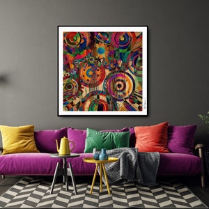 Puede incluir: Impresión de arte abstracto con un diseño geométrico colorido que presenta círculos, cuadrados y otras formas en tonos de rojo, azul, verde, amarillo y naranja. La impresión está enmarcada en un marco negro y está colgada en una pared gris sobre un sofá rosa.