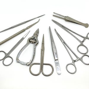 Vintage Medical Instrument Lot: Surgical Tools, Forceps, Hemostats (9 Pcs.)