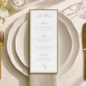 Peut inclure: Une carte de menu rectangulaire blanche avec une fine bordure vert olive, présentant une élégante typographie à empattements. Le texte liste les plats, dont Starter, Main et Dessert, avec les initiales BG en bas, centrée sur une assiette blanche.