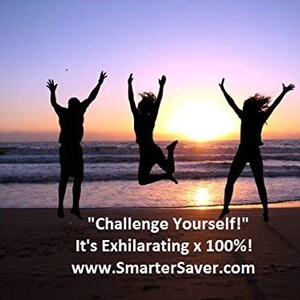 May include: Three silhouettes of people jumping in the air with their arms raised on a beach at sunset. The text "Challenge Yourself!" is below the silhouettes, followed by "It's Exhilarating x 100%!" and "www.SmarterSaver.com".