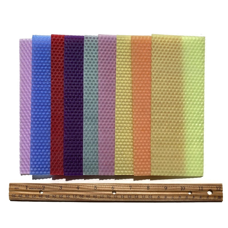 1 pound, 30 pieces, of Assorted beeswax scrap pieces. Each scrap sheet measures between 2 - 3 inches wide by 8 inches long.