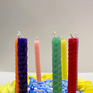 Hand rolled birthday candles using the Small Beeswax Candle Making Kit. 9 sheets of beeswax pre cut, in an assortment of colors. Kit contains instructions on how to roll candles plus wick!