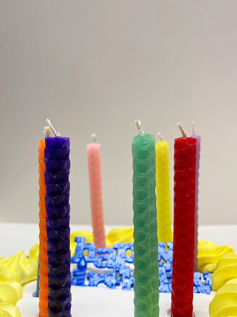 Hand rolled birthday candles using the Small Beeswax Candle Making Kit. 9 sheets of beeswax pre cut, in an assortment of colors. Kit contains instructions on how to roll candles plus wick!