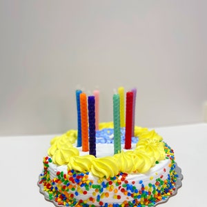 Hand rolled birthday candles using the Small Beeswax Candle Making Kit. 9 sheets of beeswax pre cut, in an assortment of colors. Kit contains instructions on how to roll candles plus wick!