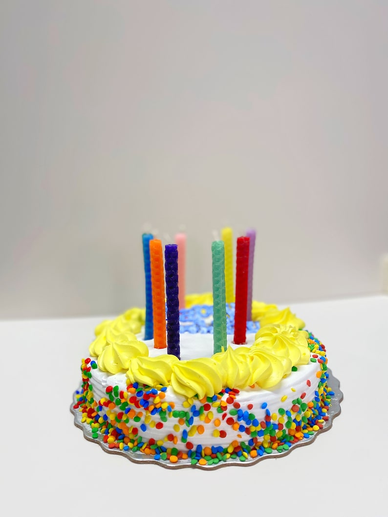 Hand rolled birthday candles using the Small Beeswax Candle Making Kit. 9 sheets of beeswax pre cut, in an assortment of colors. Kit contains instructions on how to roll candles plus wick!