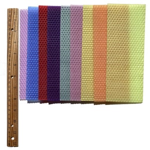 1 pound, 30 pieces, of Assorted beeswax scrap pieces. Each scrap sheet measures between 2 - 3 inches wide by 8 inches long.