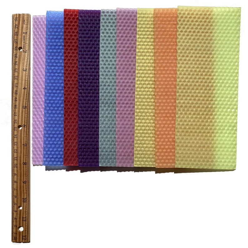 1 pound, 30 pieces, of Assorted beeswax scrap pieces. Each scrap sheet measures between 2 - 3 inches wide by 8 inches long.