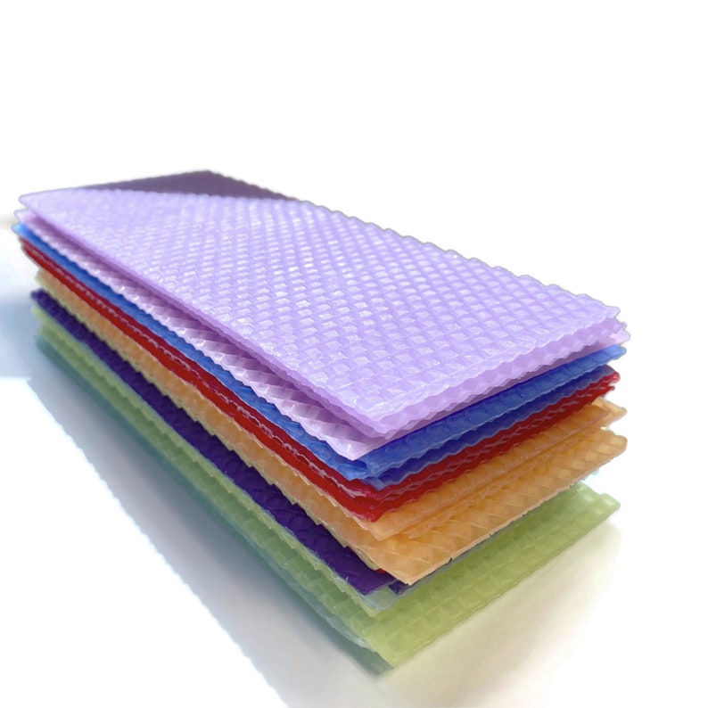 1 pound, 30 pieces, of Assorted beeswax scrap pieces. Each scrap sheet measures between 2 - 3 inches wide by 8 inches long.