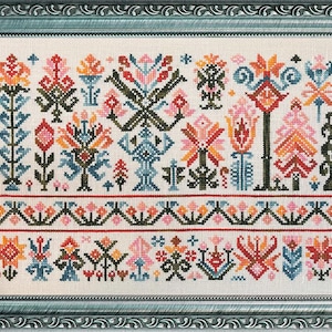 May include: A cross-stitch pattern featuring a colorful floral design with geometric shapes and a repeating border. The pattern is stitched on white fabric and includes shades of pink, orange, red, blue, green, and brown.