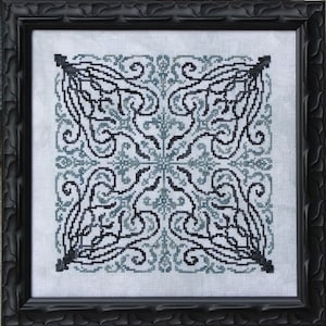 May include: A black and white cross stitch pattern with a blue and white background. The pattern is a symmetrical design with intricate details.