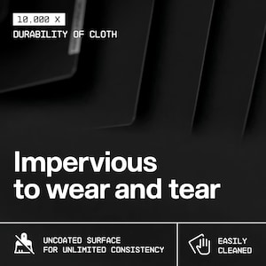 May include: Black background with white text that reads "10,000 X DURABILITY OF CLOTH" and "Impervious to wear and tear." Below are icons and text: "UNCOATED SURFACE FOR UNLIMITED CONSISTENCY" and "EASILY CLEANED."