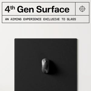 May include: A black rectangular mousepad with a gray wireless mouse. The mousepad has the text "4th Gen Surface" and "AN AIMING EXPERIENCE EXCLUSIVE TO GLASS" in white. A target icon is in the upper right corner.