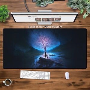 May include: A dark blue and black mouse mat with a fantasy landscape featuring a large tree with glowing pink light and a silhouette of a person standing in front of a river. The mouse mat measures 36x16 inches or 900x400 millimetres.