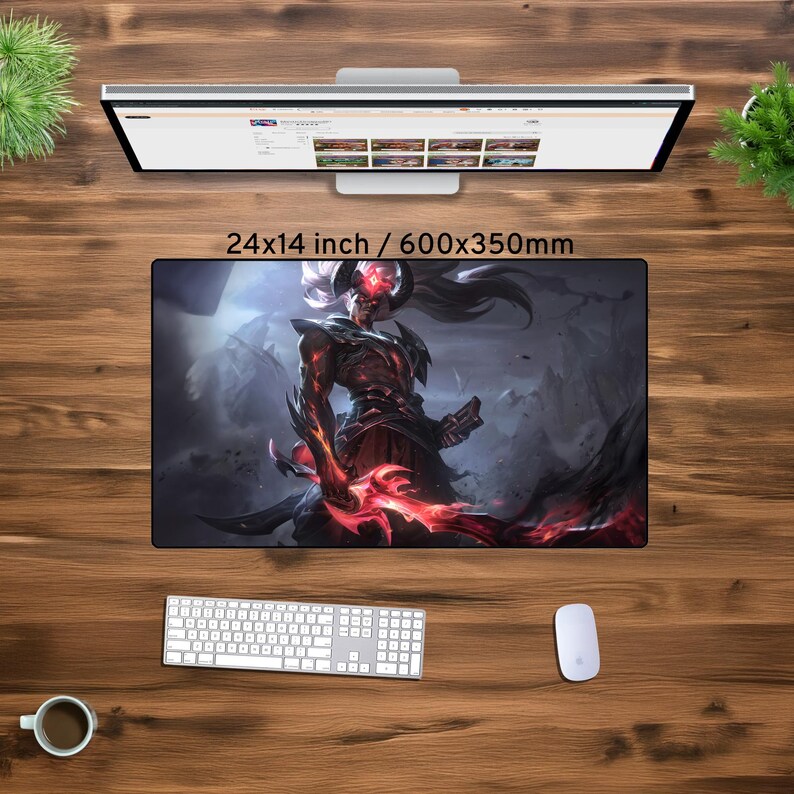 May include: A large gaming mouse mat featuring a digital illustration of a character from the video game League of Legends. The character is a demon with red eyes and horns, holding a glowing red sword. The background is a dark, fantasy landscape. The mouse mat is 61x35.5 cm.