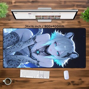 May include: A large mousepad featuring a digital illustration of a woman with long white hair and blue eyes. She is wearing a white and gray patterned outfit and a silver necklace with a blue gem. The background is a dark blue with white stars. The mousepad is 36x16 inches or 900x400 millimeters.