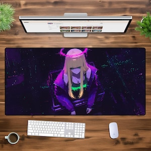 May include: A rectangular mouse mat with an anime-style illustration of a woman with blonde hair, a purple jacket, and a neon green top. The background is a dark, city-like scene. A keyboard, mouse, and monitor are also visible.