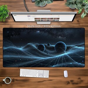 May include: A black and blue galaxy-themed mousepad with a 3D effect of a glowing, swirling nebula. The mousepad is 36 inches by 16 inches, or 900 millimeters by 400 millimeters.