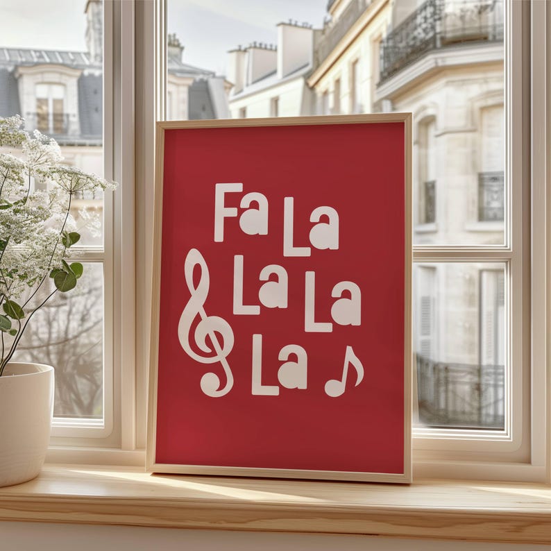 May include: A red framed print with white text that reads "Fa La La La La" with a treble clef and a musical note.