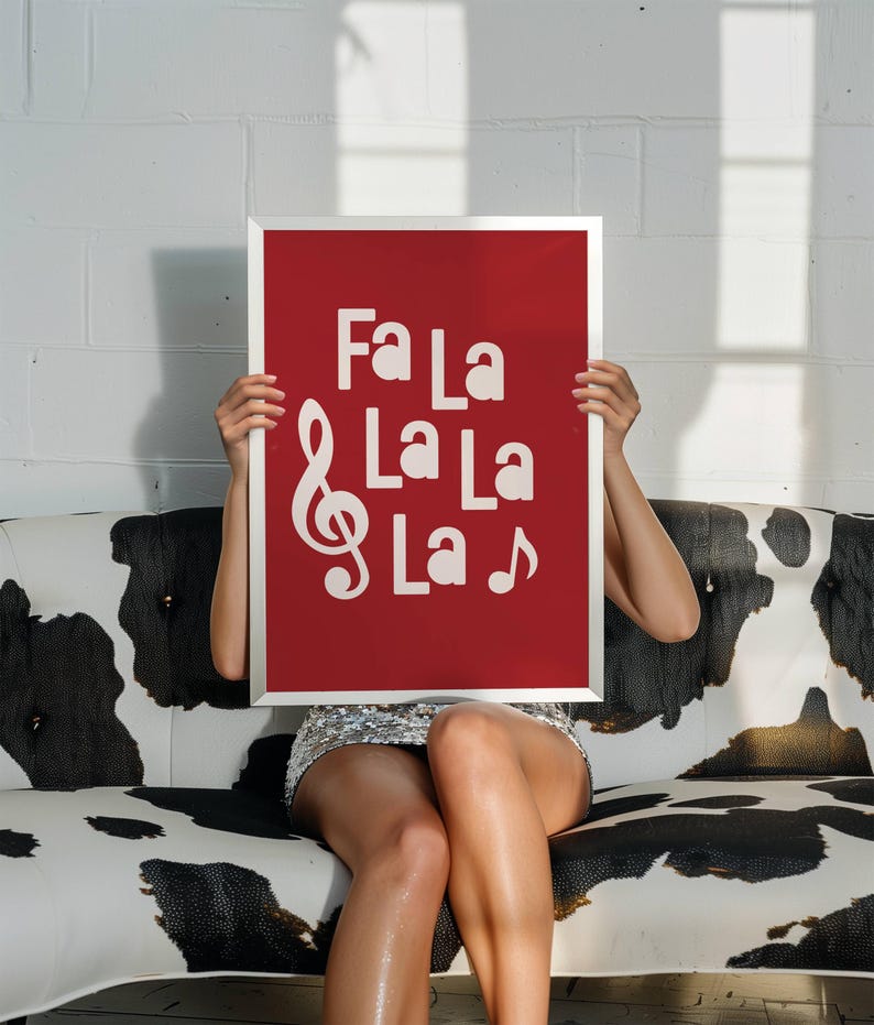 May include: A red poster with a white treble clef and the words "Fa La La La La" printed on it.