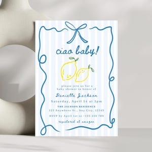 May include: A blue and white striped baby shower invitation with a hand-drawn border. The invitation says "ciao baby!" and features two yellow lemons with green leaves. The text includes the name Danielle Jackson, the date and time of the shower, the location, and the RSVP information.