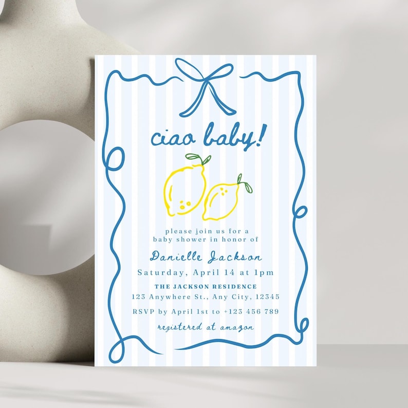 May include: A blue and white striped baby shower invitation with a hand-drawn border. The invitation says "ciao baby!" and features two yellow lemons with green leaves. The text includes the name Danielle Jackson, the date and time of the shower, the location, and the RSVP information.